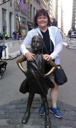 Be Fearless ~ Always This is a picture of T.R with the Fearless Girl statue in Manhattan